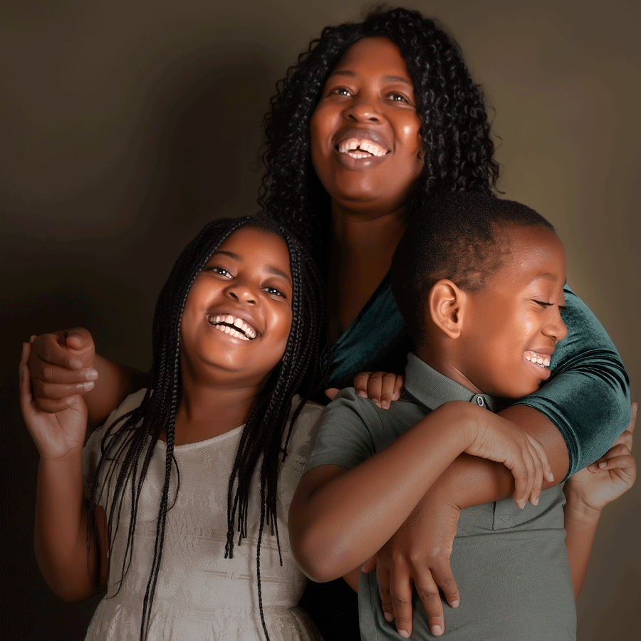 Mum with her son and daughter in a relaxed, laughing pose.